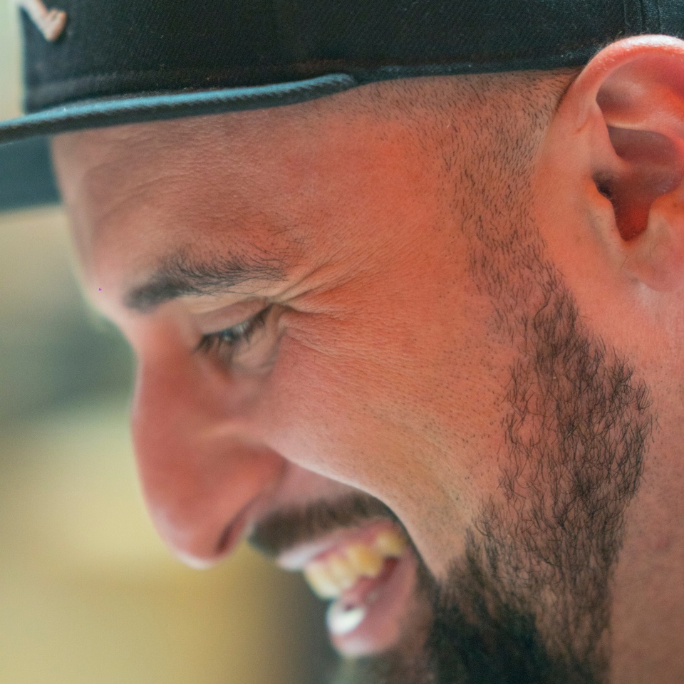 Smiling Middle Easterner, close-up profile portrait