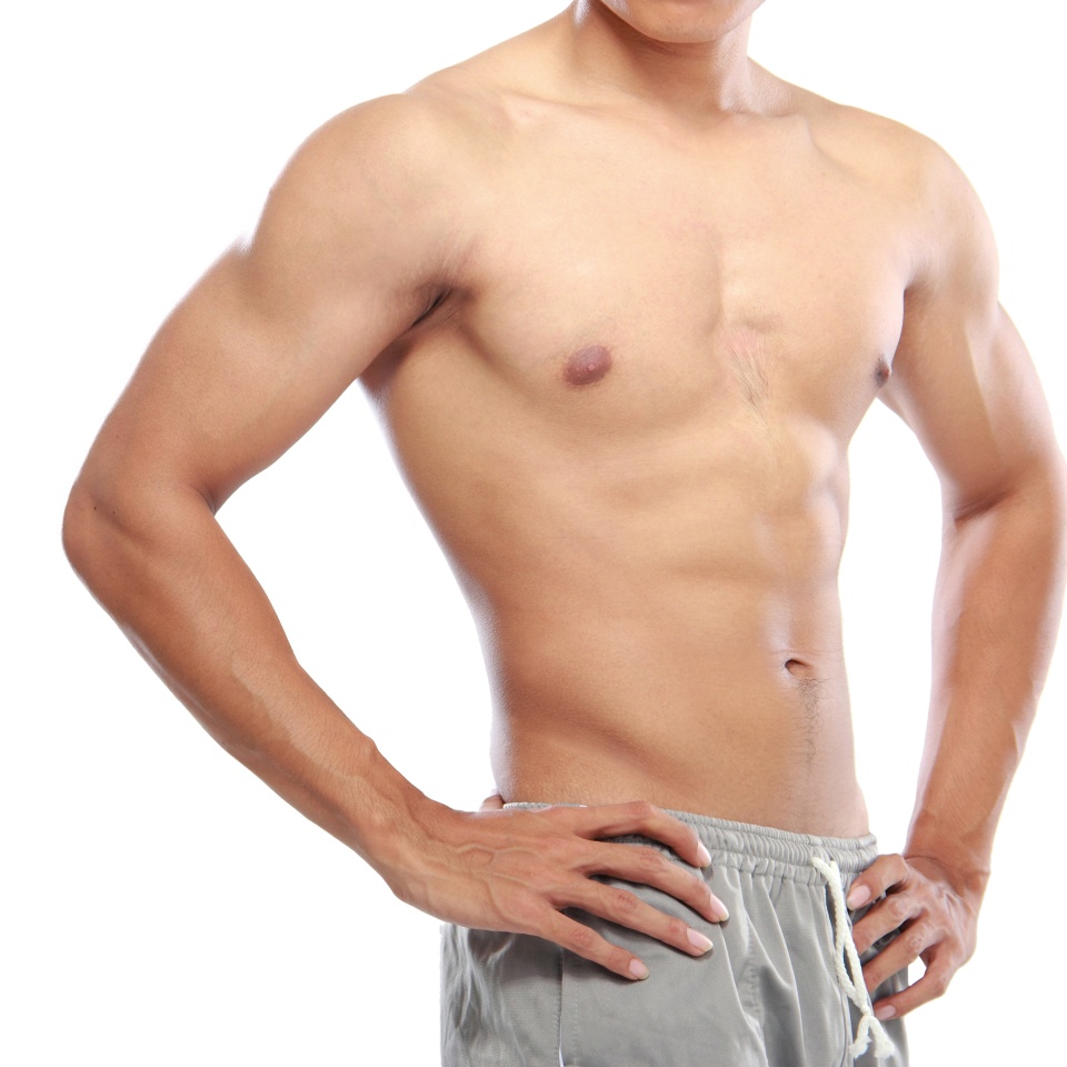 a very fit young male flexing his muscles