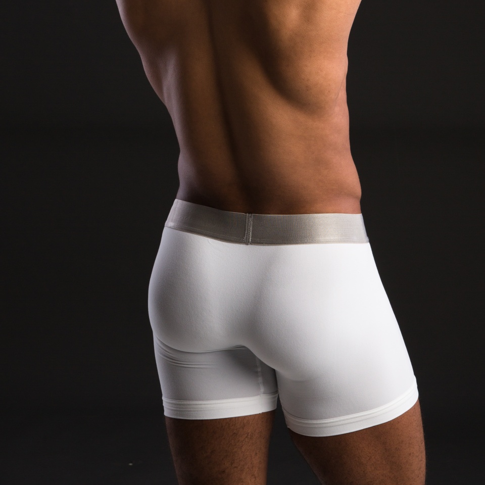 Black Male Wearing White Underwear on Dark Background