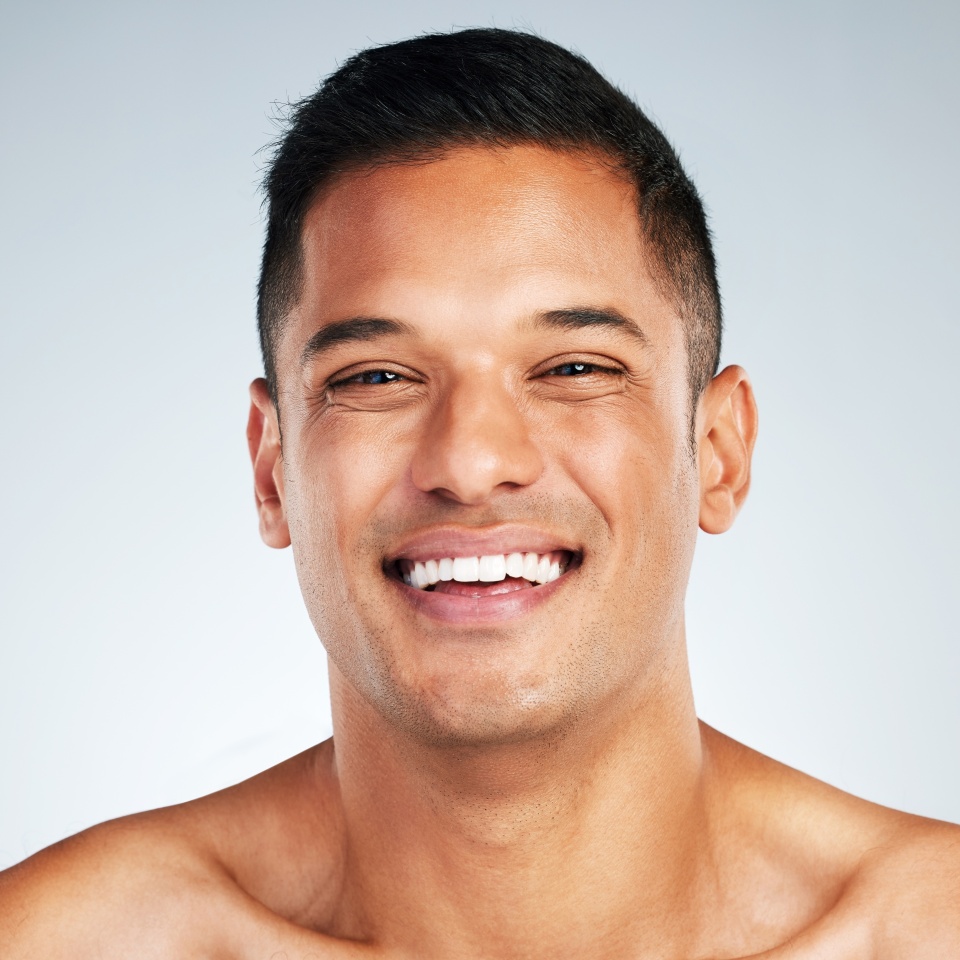 Man face, skin and teeth, natural beauty and skincare, happy model in cosmetology advertising. Clean and fresh, glow and facial treatment, body wellness or dental mouth hygiene in studio background.