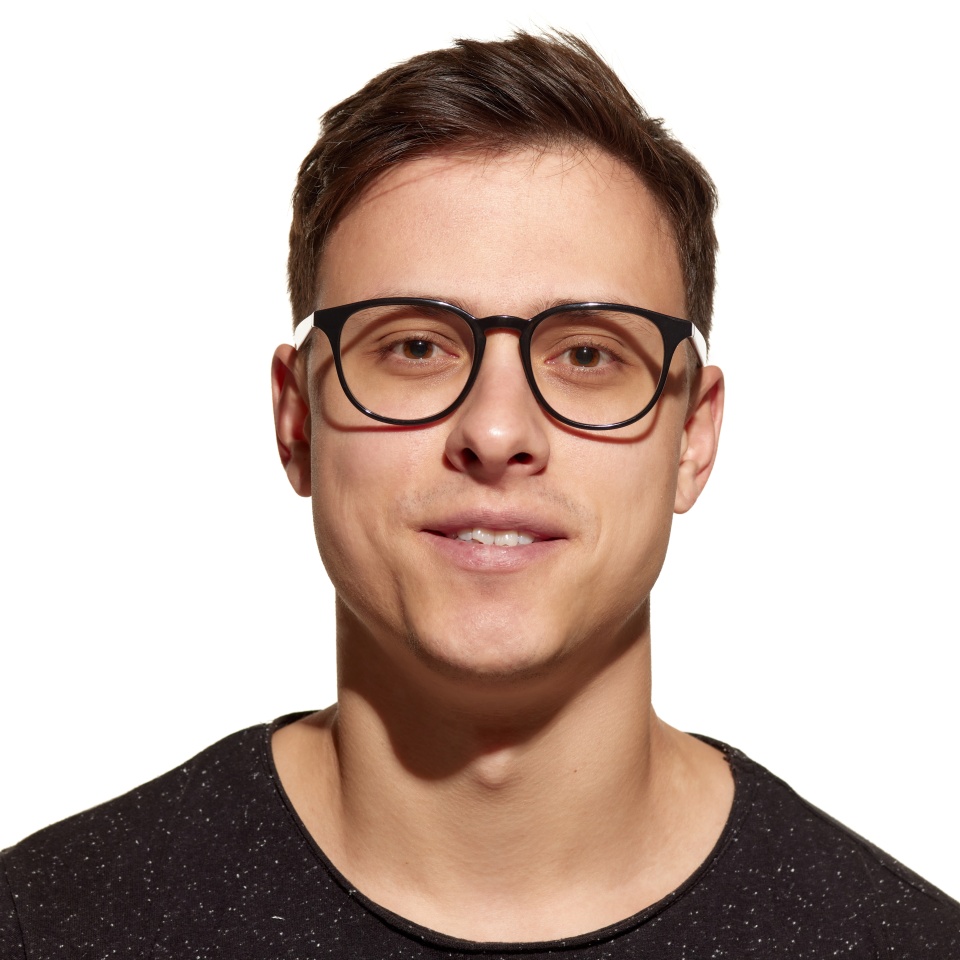 Vision correction. Close-up portrait of young handsome man wearing eyewear isolated on white studio background. Concept of men's health, self-care, body and skin care. Male model looking at camera