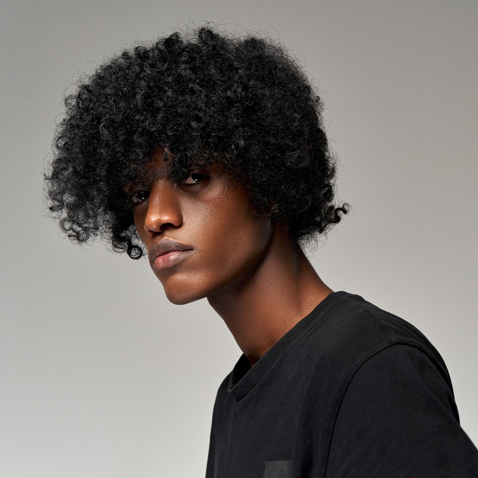 Portrait of handsome african man isolated on gray background