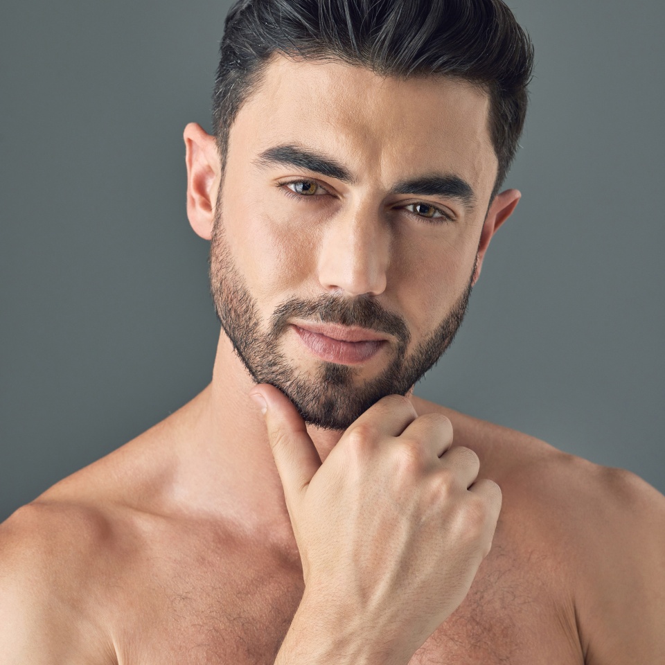 I definitely spend the time to take proper care of my skin. Shot of a handsome young man posing against a grey background.