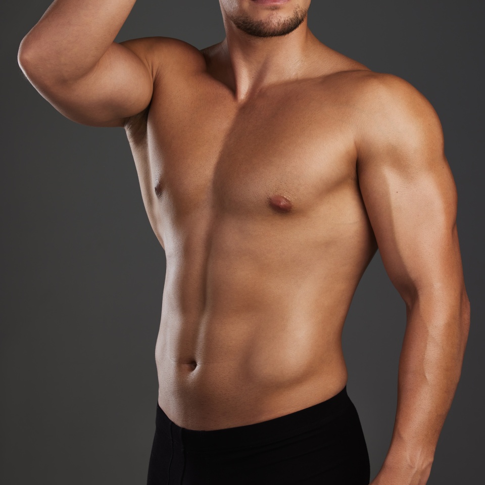 Thinking, body and fitness man in studio for wellness, training and muscle growth progress on black background. Sports, six pack and athlete with health, exercise and bodybuilding workout results