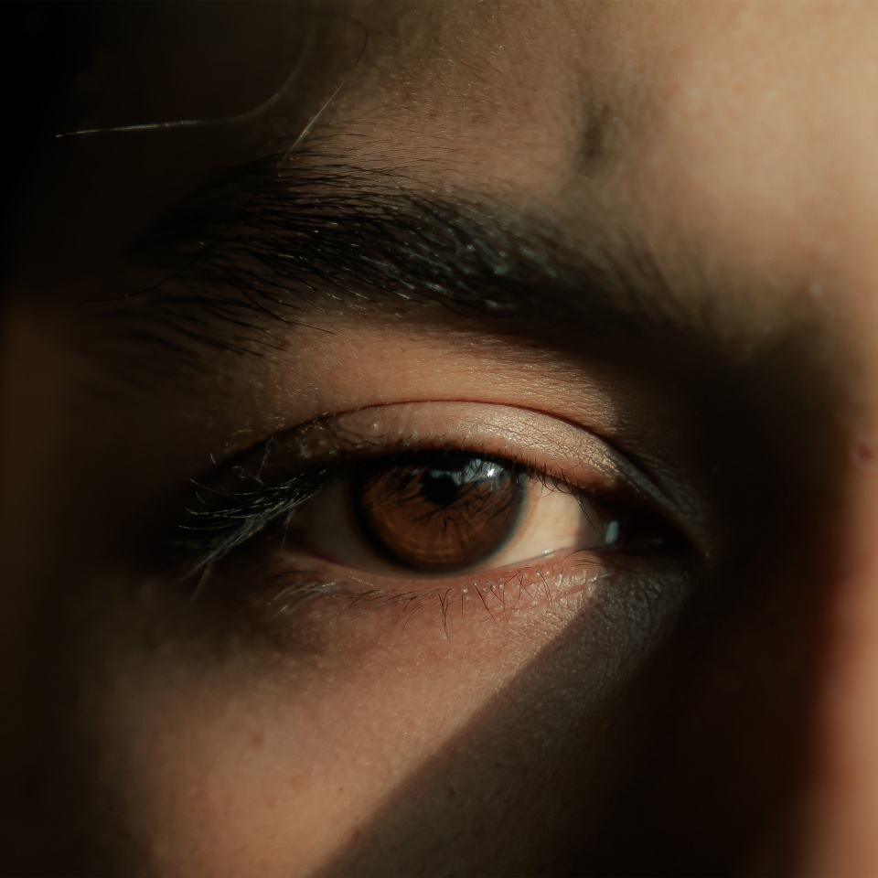 photo of a man's eyes exposed to light rays
