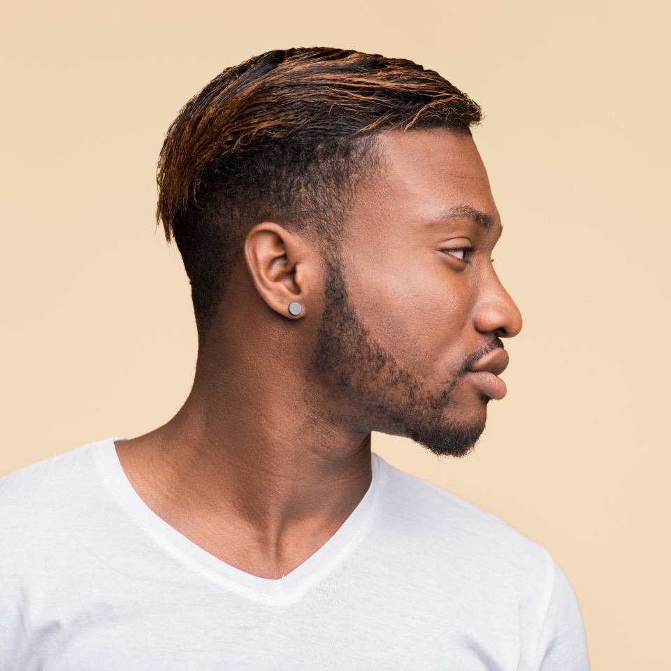 Profile Portrait Of African American Man Standing Over Yellow Studio Background. Panorama, Side View, Copy Space