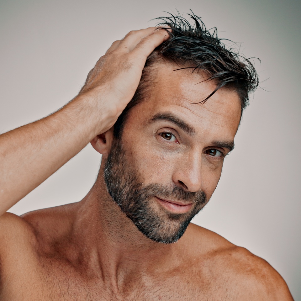 Beauty, hair and self care with portrait of man in studio for cleaning, salon grooming and hairstyle. Shampoo, cosmetics and aesthetic with person on background for texture and spa treatment