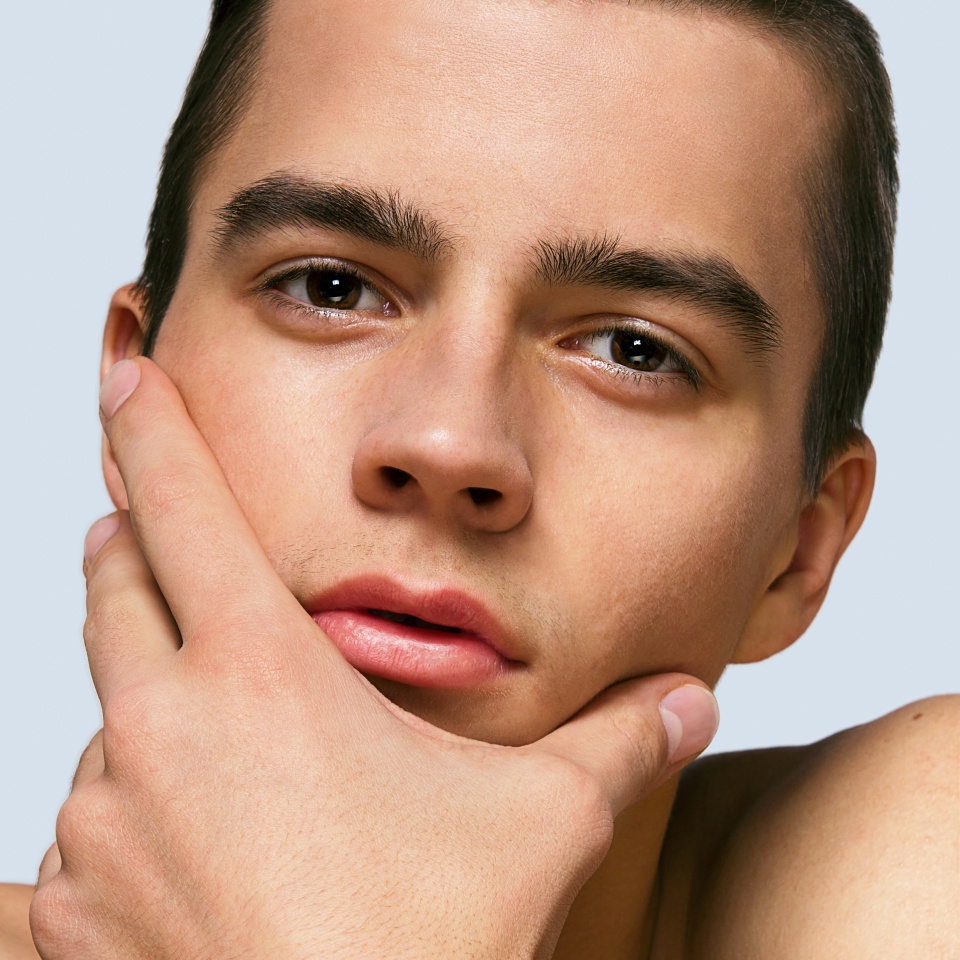 portrait of a young handsome male model young man