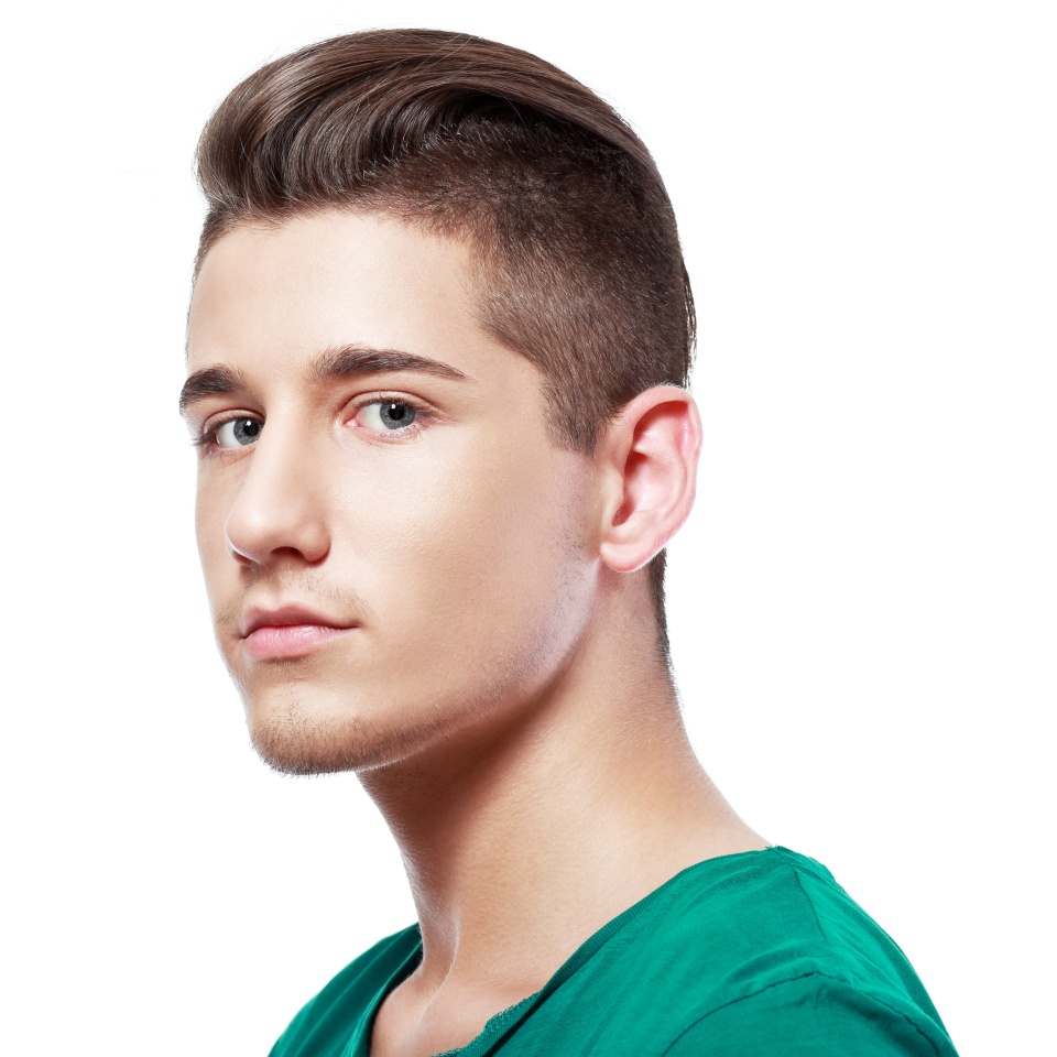 Side view of a handsome young man facial portrait isolated on a white background