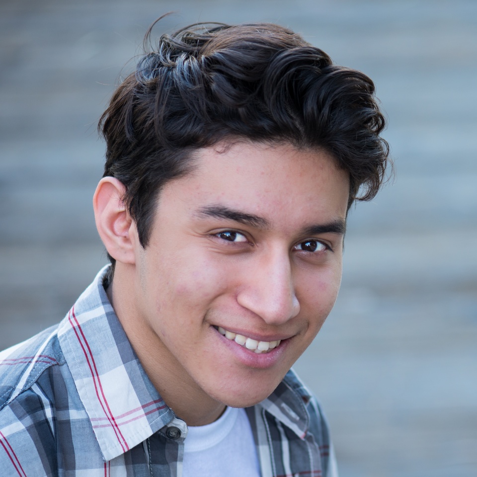Young Hispanic man smiling
