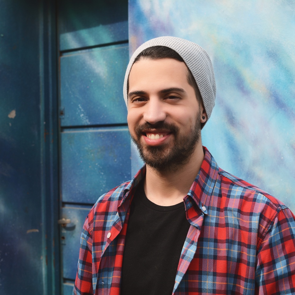Portrait of young latin man. Urban scene.
